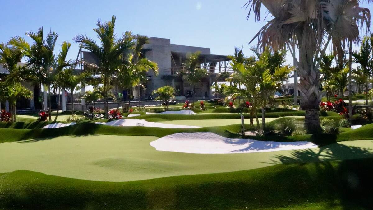Palm-lined miniature golf course at PopStroke UTC